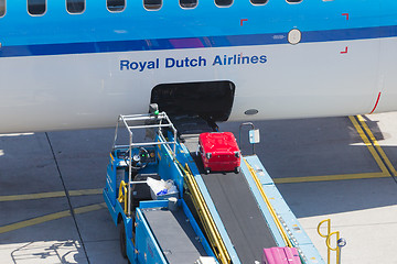 Image showing AMSTERDAM, NETHERLANDS - AUGUST 17, 2016: Loading luggage in air