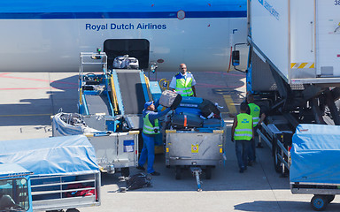 Image showing AMSTERDAM, NETHERLANDS - AUGUST 17, 2016: Loading luggage in air