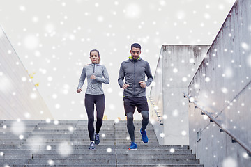 Image showing couple of sportsmen walking downstairs