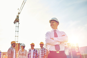 Image showing happy builders and architect at construction site