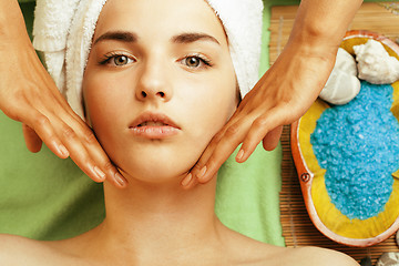 Image showing stock photo attractive lady getting spa treatment in salon, close up asian hands on face