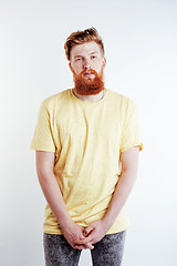 Image showing young handsome hipster ginger bearded guy looking brutal isolated on white background, lifestyle people concept