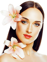 Image showing young attractive lady close up with hands on face isolated flowe