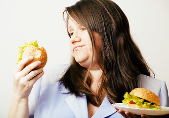 Image showing fat white woman having choice between hamburger and salad close 