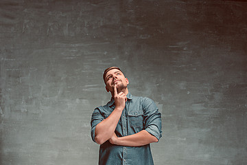 Image showing Portrait of smiling happy man standing in studio