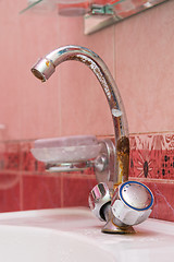 Image showing Old rusted tap on the sink in the bathroom