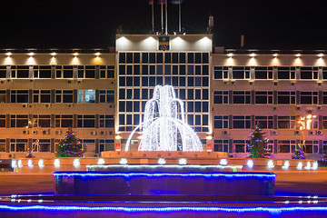 Image showing Anapa, Russia - January 7, 2017: Night landscape with a view of the administration of the city of Anapa resort and the fountain in front of it in the New Year holidays