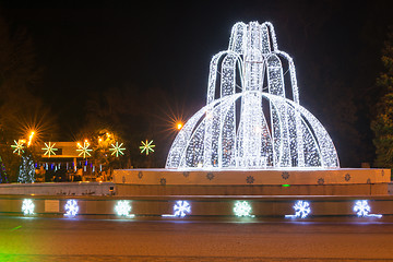 Image showing Anapa, Russia - January 7, 2017: Night landscape with a view of the administration of the city of Anapa resort and the fountain in front of it in the New Year holidays