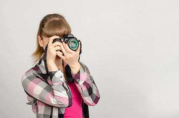 Image showing Portrait of a girl the photographer photographing camera