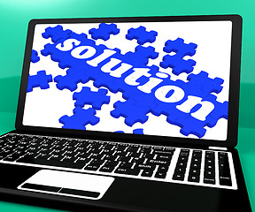 Image showing Solution Puzzle On Notebook Showing Computer Applications