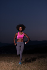 Image showing Young African american woman jogging in nature