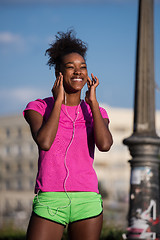 Image showing young african american woman running outdoors