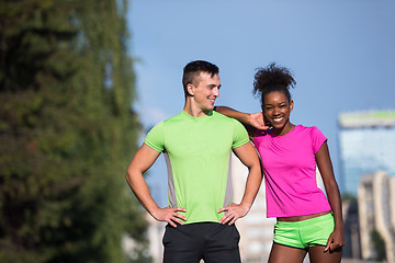 Image showing portrait of young multietnic jogging couple ready to run