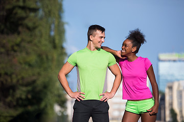 Image showing portrait of young multietnic jogging couple ready to run