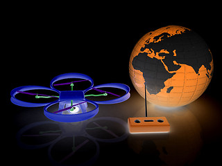 Image showing Quadrocopter Drone with Earth Globe and remote controller on a w