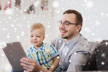 Image showing father and son with tablet pc playing at home