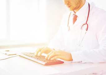 Image showing male doctor typing  on the keyboard