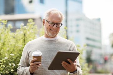 Image showing senior man with tablet pc and coffee in city