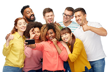 Image showing group of people taking selfie by smartphone