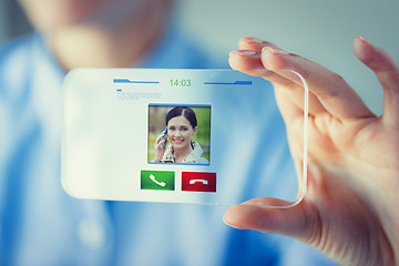 Image showing close up of woman with transparent smartphone