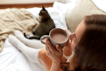 Image showing close up of happy woman with cocoa cup at home