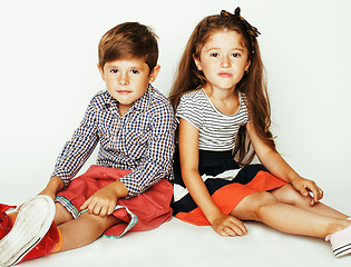 Image showing little cute boy and girl hugging playing on white background, ha