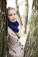 Image showing young pretty blond woman smiling happy outside in spring park close up, lifestyle people concept