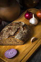 Image showing Still life with homemade bread and pottery