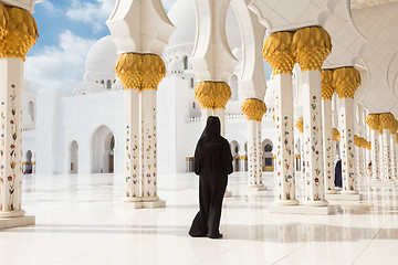 Image showing Arabic woman in black burka in Sheikh Zayed Grand Mosque, Abu Dhabi, UAE.