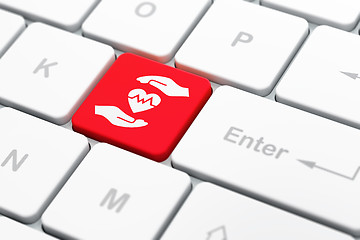 Image showing Insurance concept: Heart And Palm on computer keyboard background