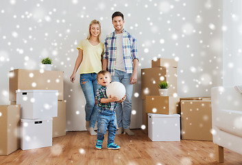 Image showing happy family moving to new home and playing ball