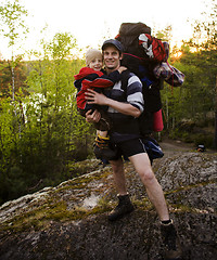 Image showing young happy father traveling with little son and huge backpack, lifestyle people concept
