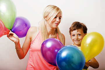 Image showing pretty real family with color balloons on white background, blon