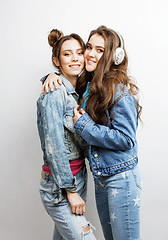 Image showing lifestyle and people concept: Fashion portrait of two stylish sexy girls best friends, over white background. Happy time for fun.