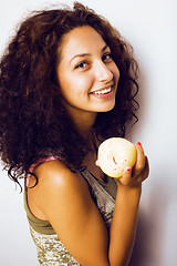 Image showing pretty young real tenage girl eating apple close up smiling