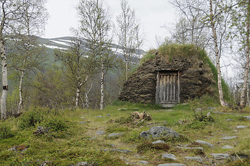 Image showing A turf hut (darfegoahti) in a Sami Camp