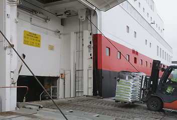 Image showing Fork lift loading goods