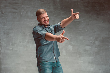 Image showing Portrait of smiling happy man standing in studio