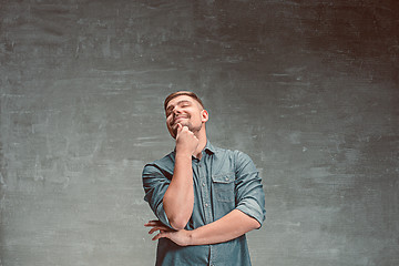 Image showing Portrait of smiling happy man standing in studio