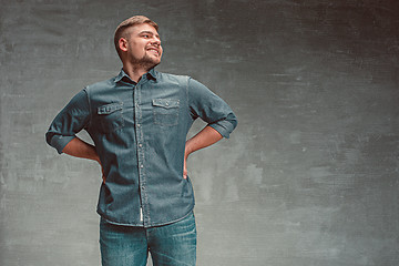 Image showing Portrait of smiling happy man standing in studio