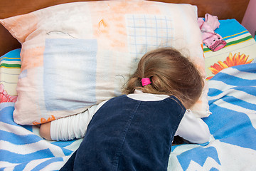 Image showing Five-year girl crying with his face buried in the pillow