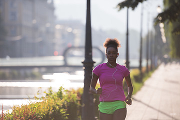 Image showing african american woman jogging in the city