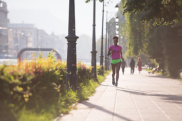 Image showing african american woman jogging in the city