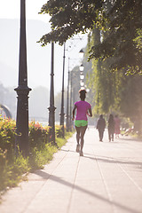 Image showing african american woman jogging in the city