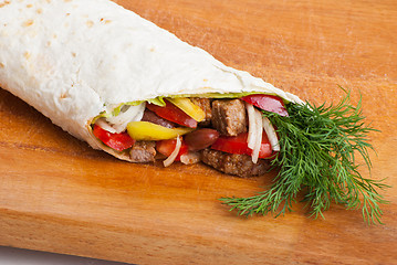 Image showing beef burrito with peppers, onion and tomato