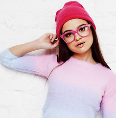 Image showing pretty young teenage girl hipster in pink glasses and hat emotional posing happy smiling, lifestyle people concept