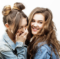 Image showing lifestyle and people concept: Fashion portrait of two stylish sexy girls best friends, over white background. Happy time for fun.