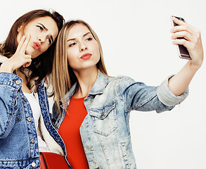 Image showing best friends teenage girls together having fun, posing emotional on white background, besties happy smiling, lifestyle people concept