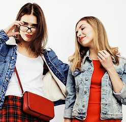 Image showing best friends teenage girls together having fun, posing emotional on white background, besties happy smiling, lifestyle people concept