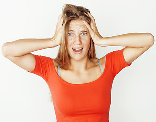 Image showing young cute blonde girl posing emotional on white background isolated, lifestyle people concept